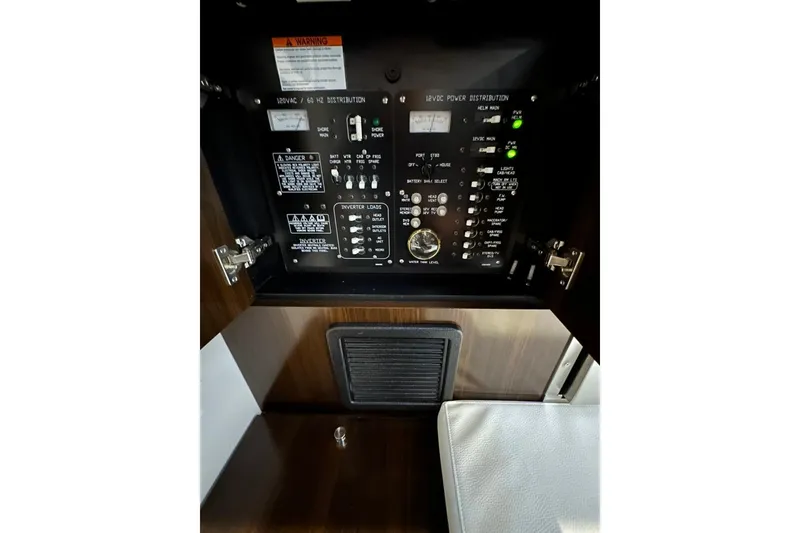 Slide: The Image of Electrical panel inside 2021 Cruisers Yachts 338 South Beach Edition Bow Rider. - 22