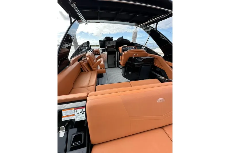 Slide: The Image of 2021 Cruisers Yachts 338 South Beach Edition Bow Rider with luxurious tan seating. - 24