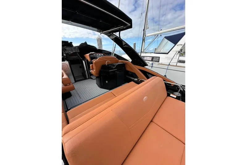 Slide: The Image of 2021 Cruisers Yachts 338 South Beach Edition Bow Rider with luxurious tan seating. - 26