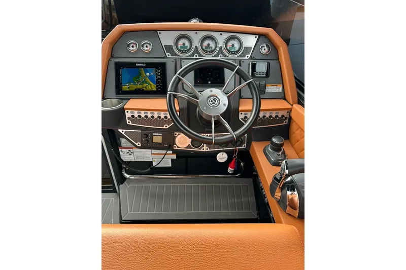 Slide: The Image of 2021 Cruisers Yachts 338 South Beach Edition Bow Rider helm with modern controls and navigation. - 3