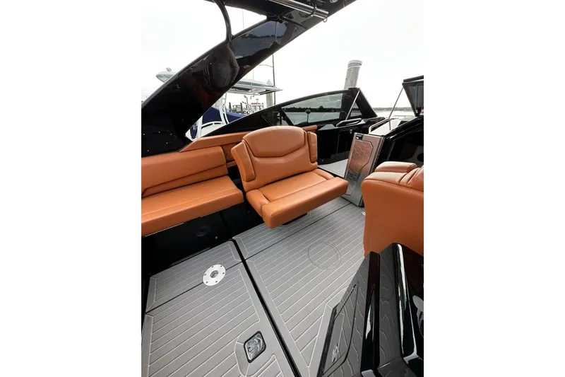 Slide: The Image of 2021 Cruisers Yachts 338 South Beach Edition Bow Rider interior with tan leather seating. - 30