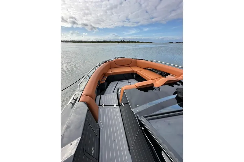 Slide: The Image of 2021 Cruisers Yachts 338 South Beach Edition Bow Rider on serene water. - 38