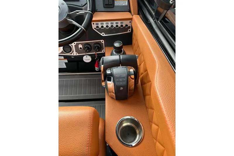 Slide: The Image of 2021 Cruisers Yachts 338 South Beach Edition Bow Rider helm with leather accents and controls. - 7