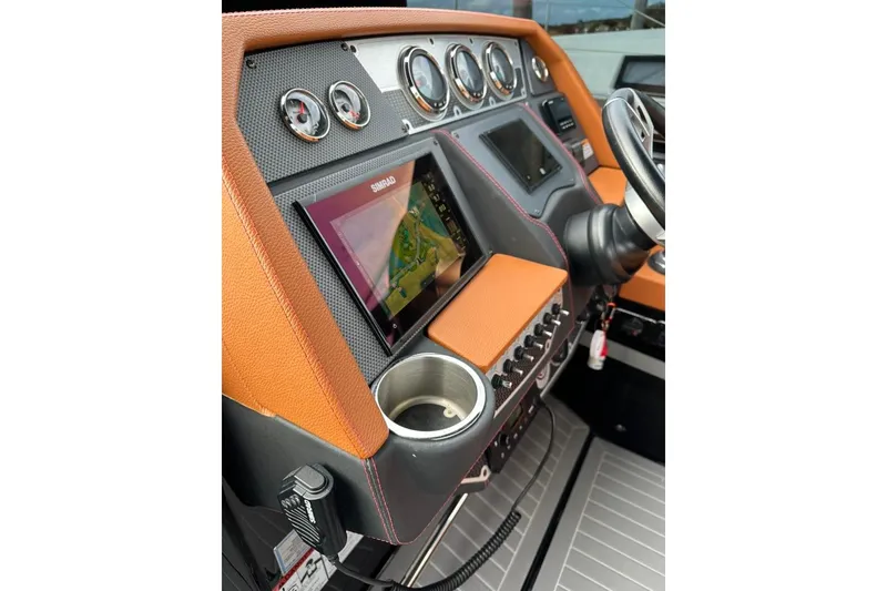 Slide: The Image of 2021 Cruisers Yachts 338 South Beach Edition Bow Rider dashboard with navigation system and controls. - 9