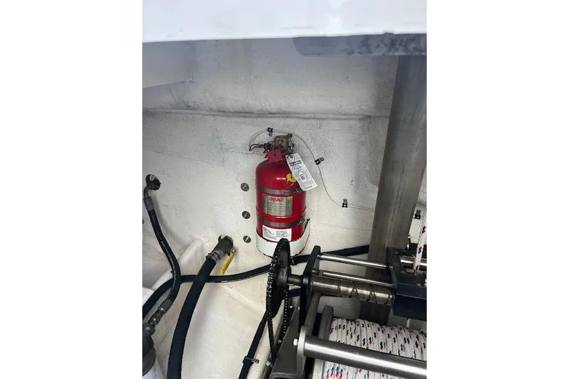 Slide: The Image of Engine compartment of 2015 Comercial Water Sports Ocean Pro 31 with fire extinguisher. - 19