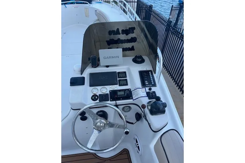 Slide: The Image of Cockpit of 2015 Comercial Water Sports Ocean Pro 31 with Garmin navigation system. - 28