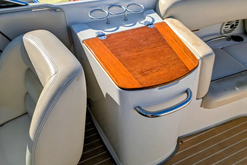 Slide: The Image of 2008 Chris-Craft Launch 25 interior with wooden table and leather seating. - 20