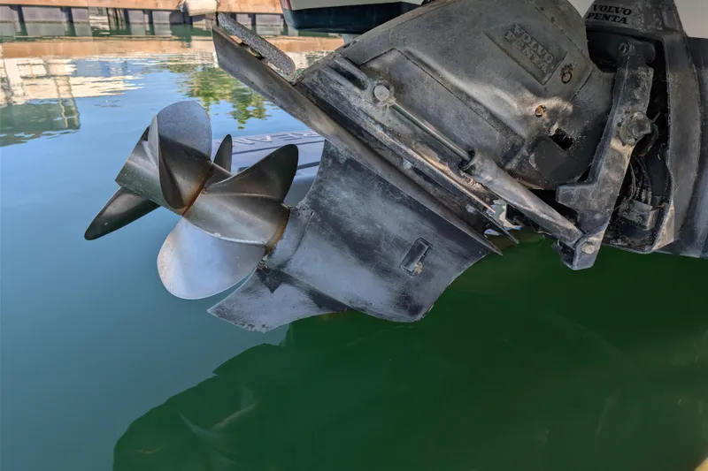 Slide: The Image of 2008 Chris-Craft Launch 25 boat propeller and outdrive in water. - 23