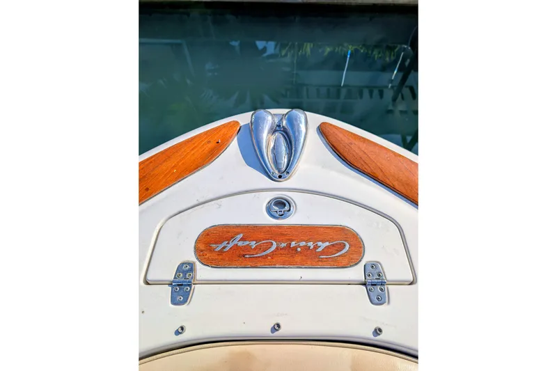 Slide: The Image of 2008 Chris-Craft Launch 25 boat bow with wood accents and logo detail. - 7