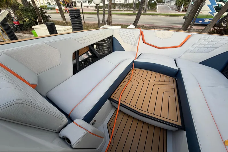 Slide: The Image of 2022 Nautique Super Air Nautique G25 interior with stylish seating and modern design. - 15