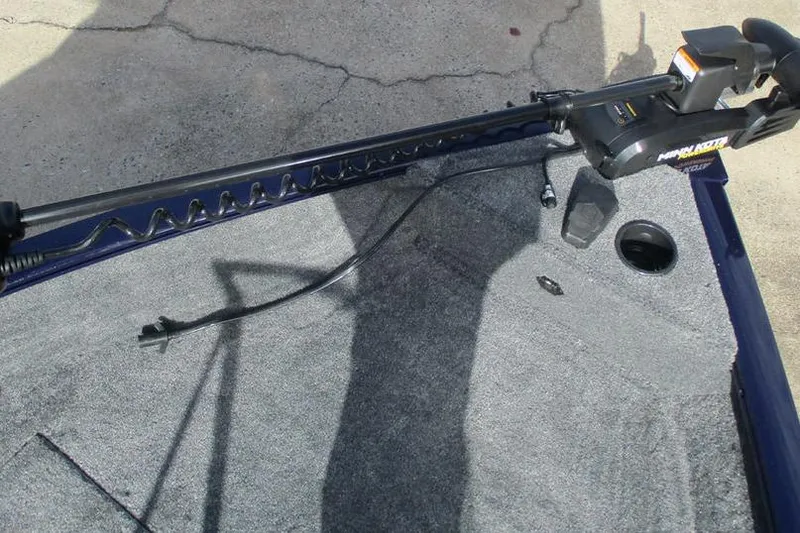 Slide: The Image of 2026 Tracker Pro Guide V-16 WT boat deck with trolling motor and carpeted surface. - 3