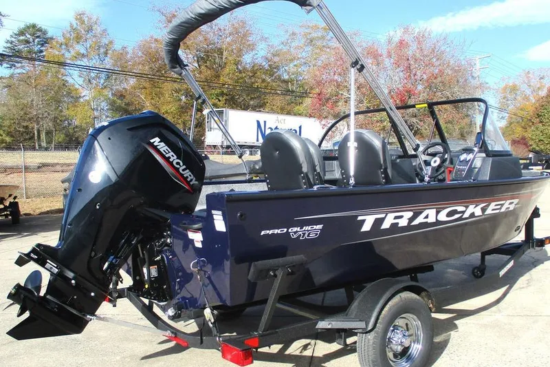 Slide: The Image of 2026 Tracker Pro Guide V-16 WT boat with Mercury outboard engine on trailer. - 5