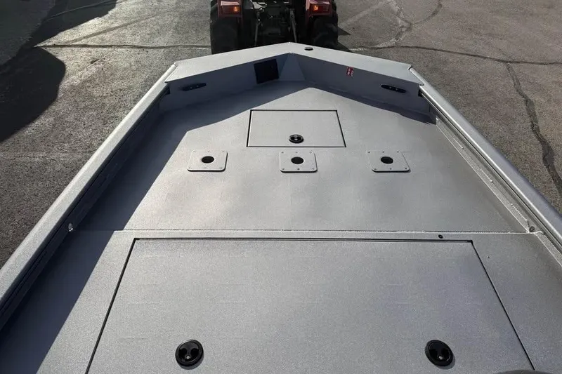 Slide: The Image of 2026 Lowe Outlet 20 boat deck with storage compartments and rod holders. - 12