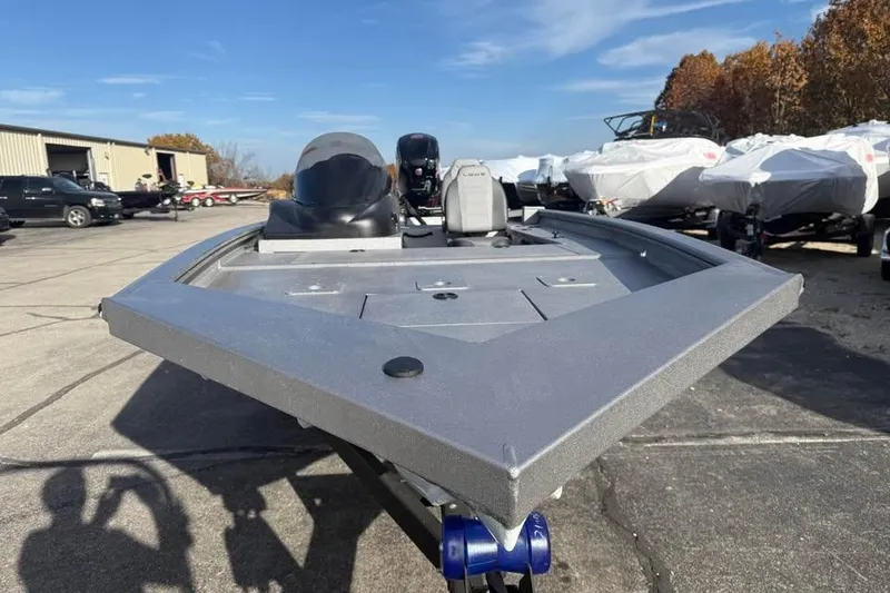 Slide: The Image of 2026 Lowe Outlet 20 boat on display in a parking lot with clear skies. - 2