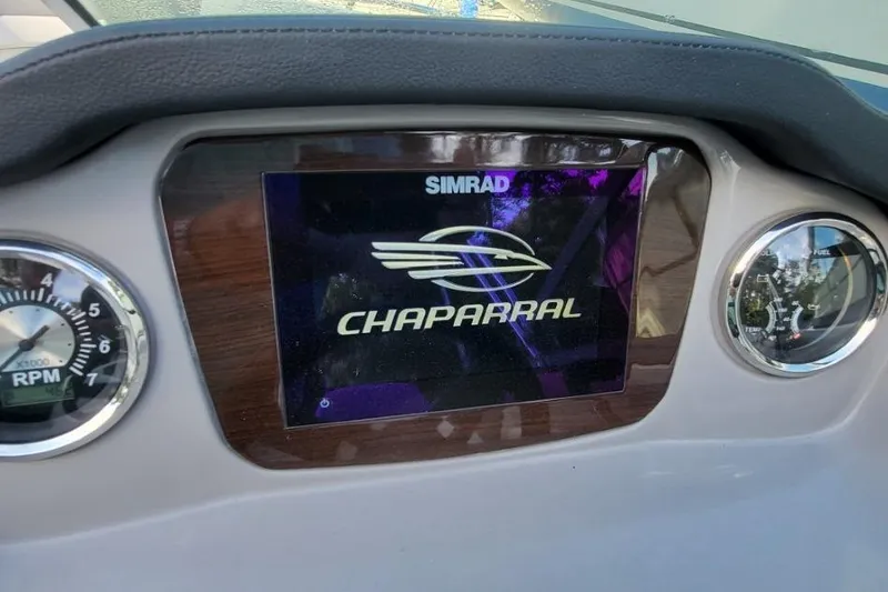 Slide: The Image of Dashboard of 2022 Chaparral 23 SSi boat with Simrad display and gauges. - 10