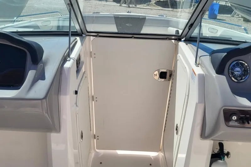 Slide: The Image of 2022 Chaparral 23 SSi boat interior with dashboard and windshield view. - 6