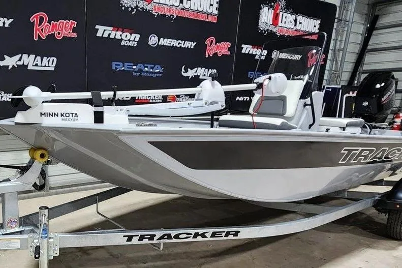 Slide: The Image of 2026 Tracker Bass Tracker Classic CC boat on trailer, displayed indoors. - 12