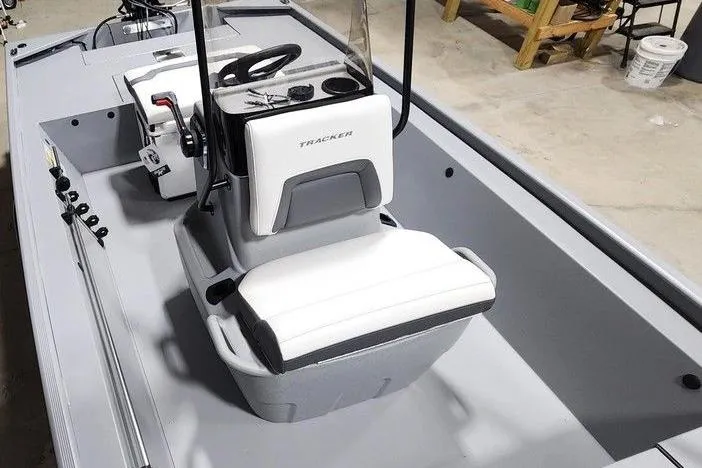 Slide: The Image of 2026 Tracker Bass Tracker Classic CC boat interior with steering console and seating. - 5