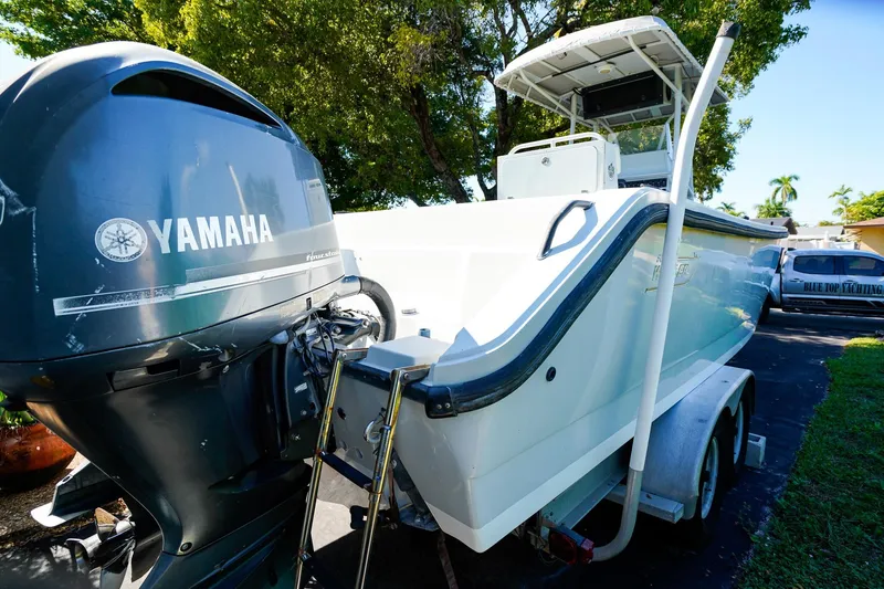 Slide: The Image of 2005 Boston Whaler 260 Justice boat with Yamaha engine on trailer. - 17