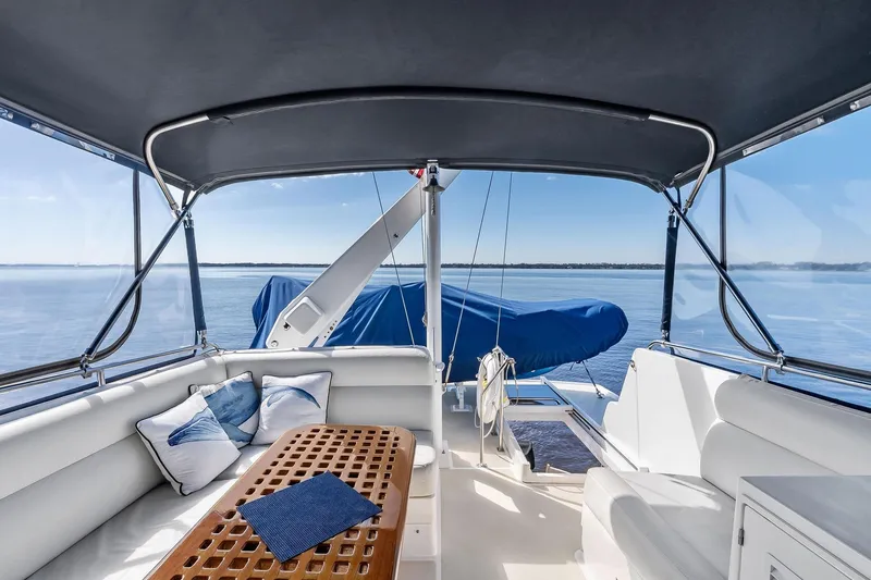 Slide: The Image of Luxurious 2006 Grand Banks Europa 47 yacht interior with ocean view and comfortable seating. - 14