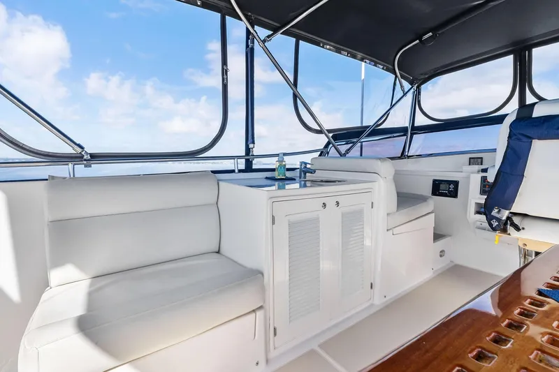Slide: The Image of Interior of 2006 Grand Banks Europa 47 yacht with seating and helm station. - 16