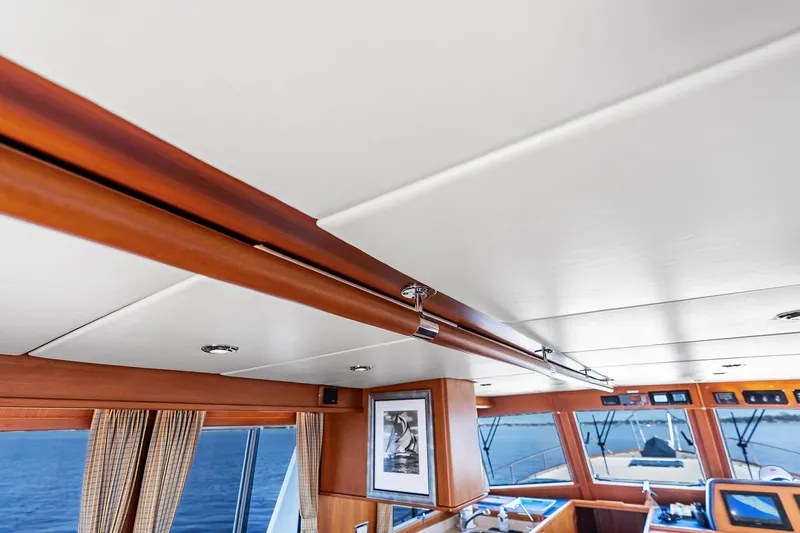 Slide: The Image of Interior of 2006 Grand Banks Europa 47 yacht with wood accents and ocean view. - 31