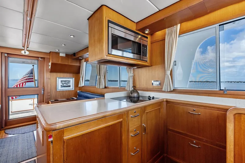 Slide: The Image of Interior of 2006 Grand Banks Europa 47 yacht with wooden cabinetry and ocean view. - 33