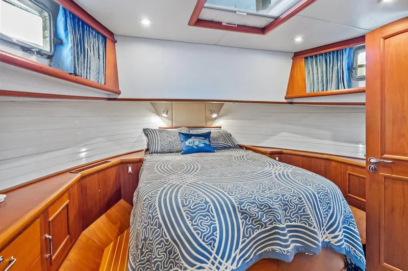 Slide: The Image of Luxurious cabin interior of 2006 Grand Banks Europa 47 yacht with elegant wood finish. - 41