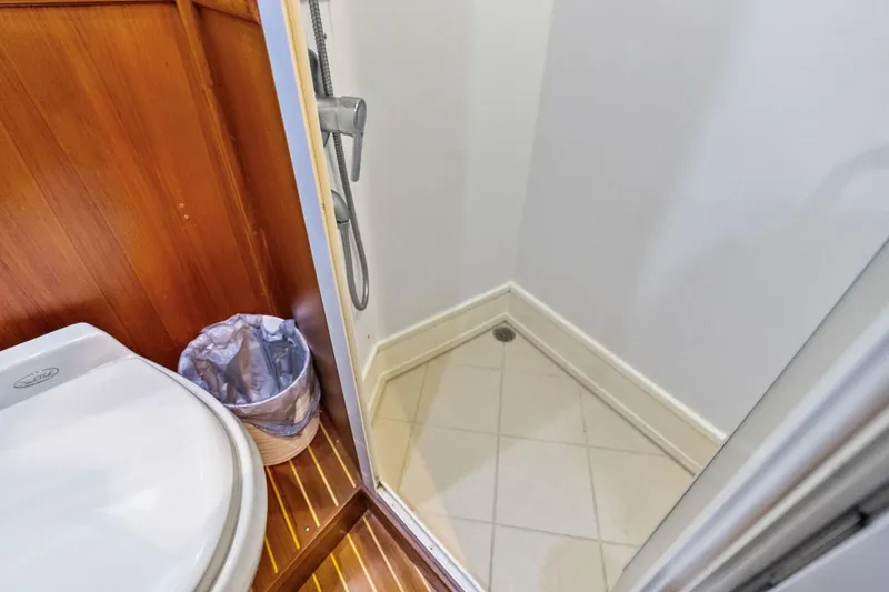 Slide: The Image of Bathroom interior of 2006 Grand Banks Europa 47 yacht, featuring shower and toilet. - 44