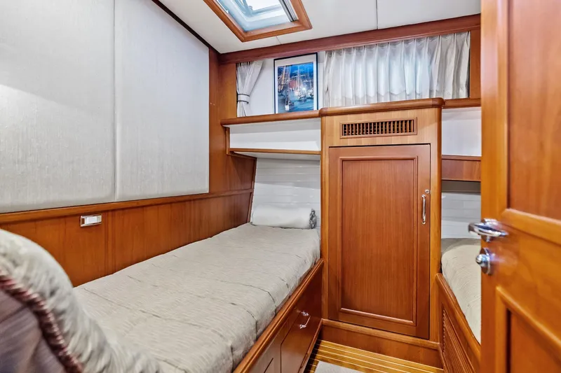 Slide: The Image of Luxurious cabin interior of 2006 Grand Banks Europa 47 yacht with wooden furnishings. - 46