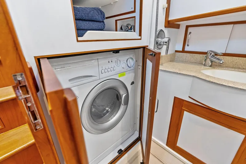 Slide: The Image of Laundry area with washer in 2006 Grand Banks Europa 47 yacht bathroom. - 49