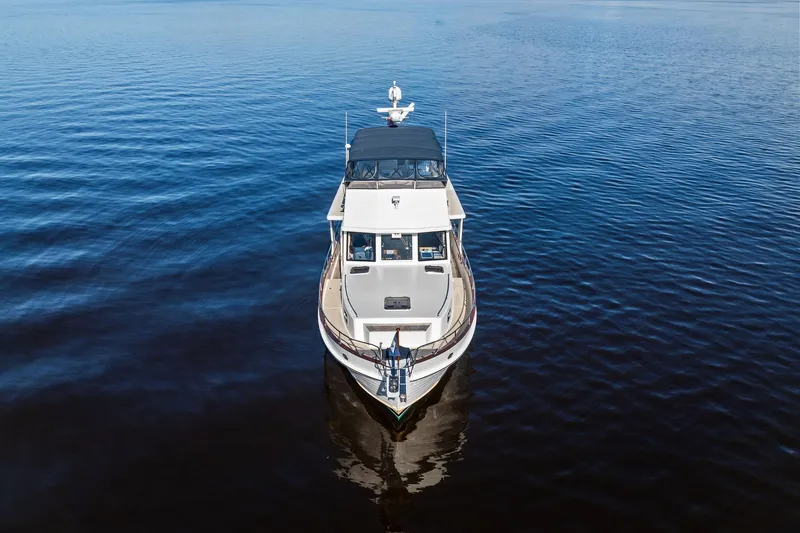 Slide: The Image of 2006 Grand Banks Europa 47 yacht on calm blue water, aerial view. - 5