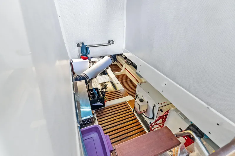 Slide: The Image of Engine room of 2006 Grand Banks Europa 47 yacht with wooden flooring and equipment. - 51