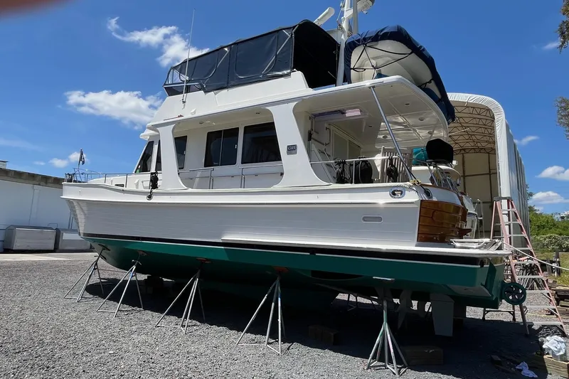 Slide: The Image of 2006 Grand Banks 47 Heritage EU yacht on stands, outdoor storage, clear sky background. - 61