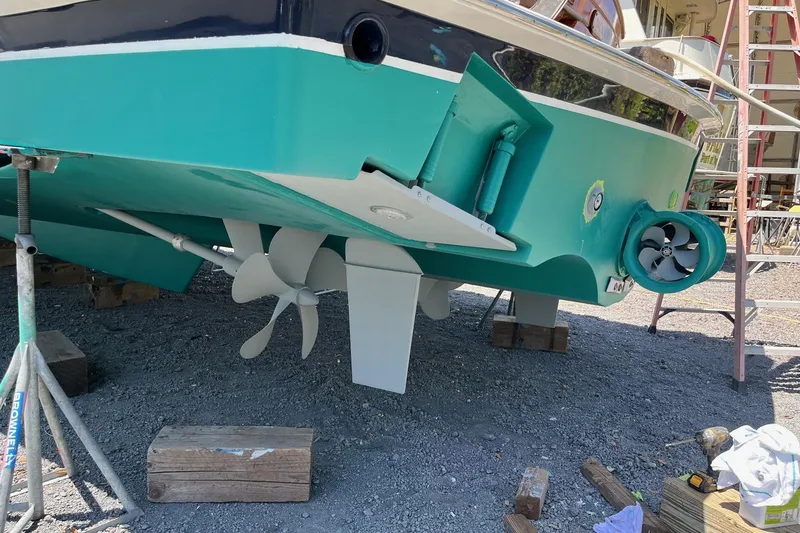 Slide: The Image of 2006 Grand Banks 47 Heritage EU yacht under maintenance, showcasing propeller and hull details. - 65