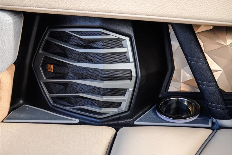 Slide: The Image of 2023 Nautique Super Air Nautique G23 Paragon interior speaker and cup holder detail. - 12