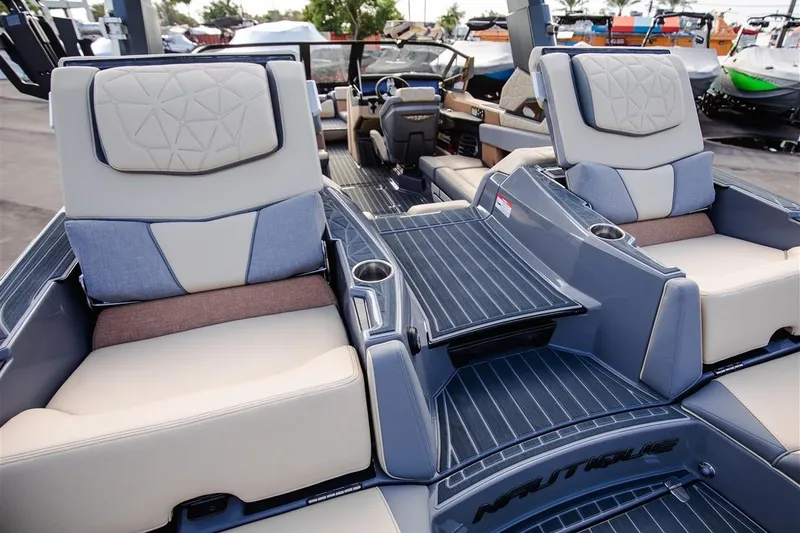 Slide: The Image of 2023 Nautique Super Air Nautique G23 Paragon interior with luxurious seating and modern design. - 14