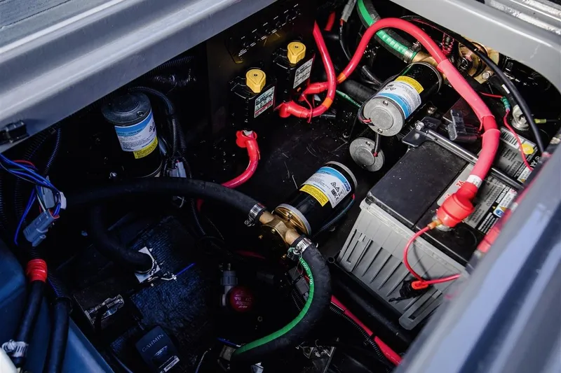 Slide: The Image of Engine compartment of 2023 Nautique Super Air Nautique G23 Paragon with wiring and components. - 16