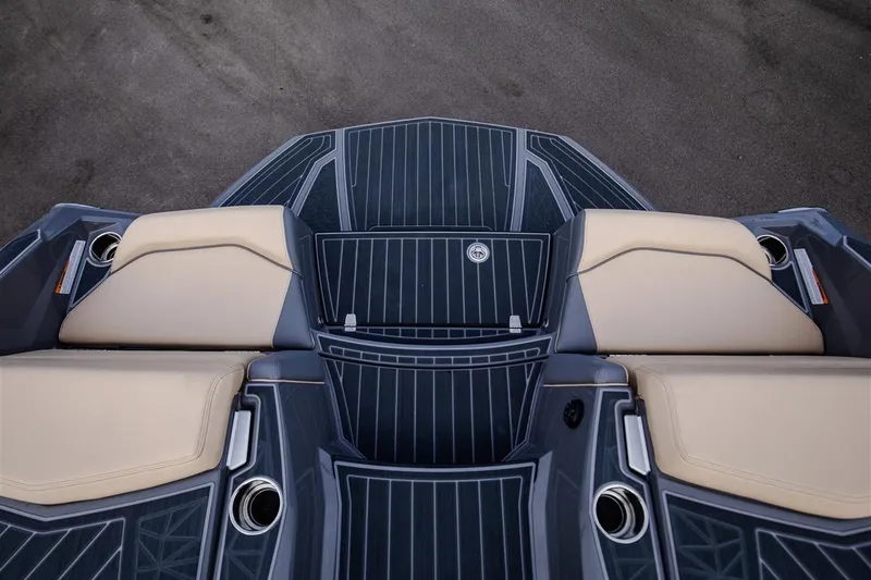 Slide: The Image of 2023 Nautique Super Air Nautique G23 Paragon boat interior with beige seating and cup holders. - 18