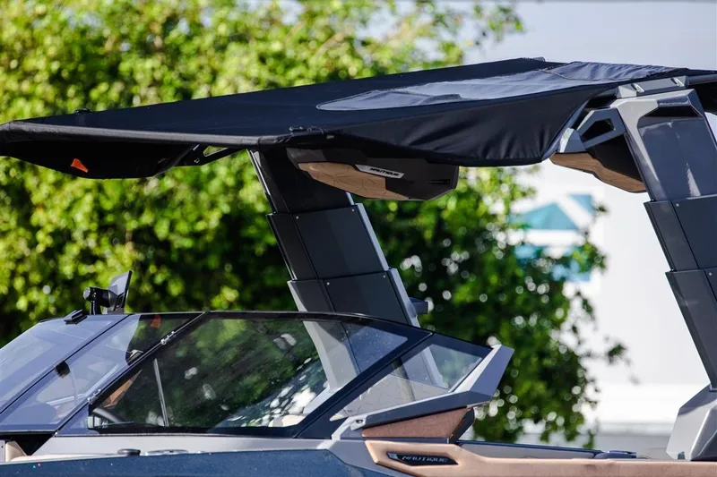 Slide: The Image of 2023 Nautique Super Air Nautique G23 Paragon boat with sleek canopy design. - 2