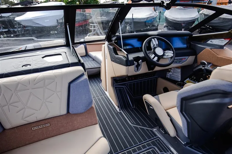 Slide: The Image of 2023 Nautique Super Air Nautique G23 Paragon interior with luxurious seating and modern dashboard. - 8