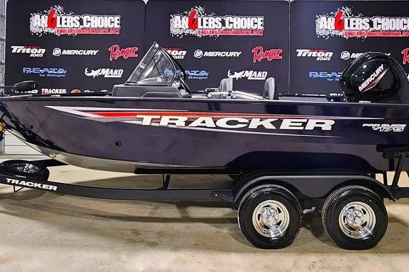 The Image of 2026 Tracker Pro Guide V-175 Combo boat on display with trailer and Mercury engine. - 0