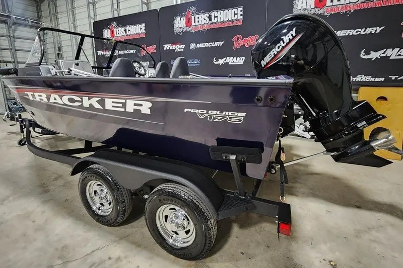 Slide: The Image of 2026 Tracker Pro Guide V-175 Combo boat with Mercury engine on trailer. - 2