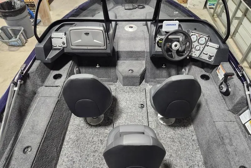 Slide: The Image of 2026 Tracker Pro Guide V-175 Combo boat interior with dual seats and steering console. - 8