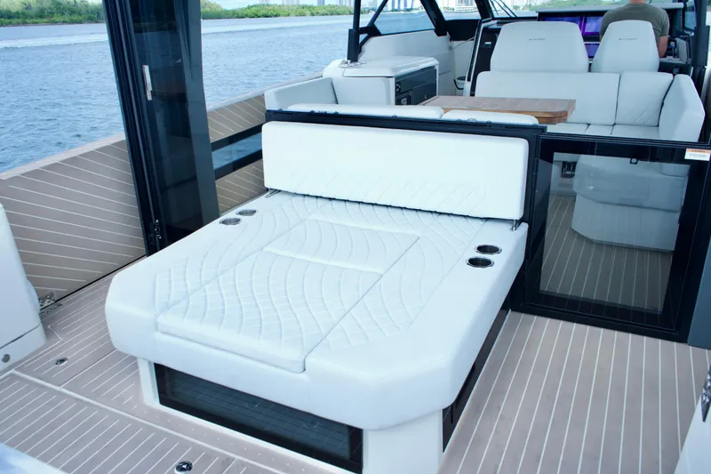 Slide: The Image of Luxurious interior of 2025 Saxdor 400 GTO yacht with white seating and modern design. - 14