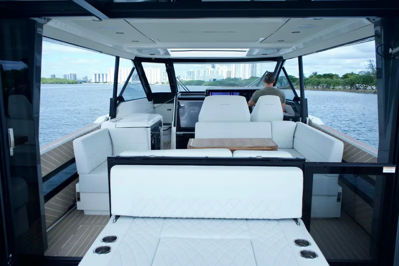 Slide: The Image of Luxurious interior of 2025 Saxdor 400 GTO yacht with modern seating and scenic water view. - 15