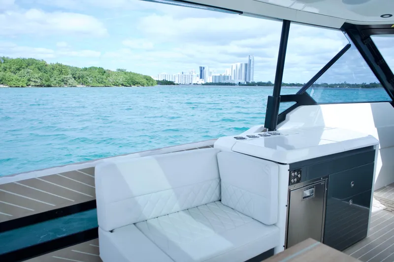 Slide: The Image of 2025 Saxdor 400 GTO luxury yacht interior with ocean view and city skyline. - 19