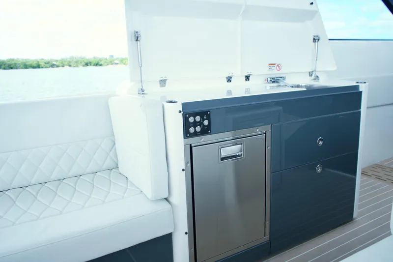 Slide: The Image of 2025 Saxdor 400 GTO yacht interior with sleek kitchenette and seating. - 20
