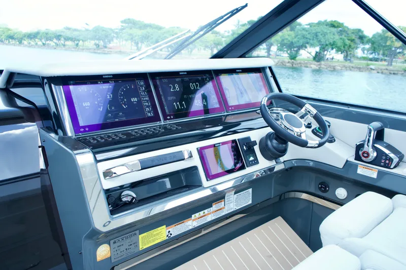 Slide: The Image of 2025 Saxdor 400 GTO helm with advanced navigation displays and controls. - 22