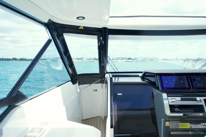 Slide: The Image of Interior view of 2025 Saxdor 400 GTO boat cockpit with ocean backdrop. - 23
